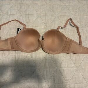 Tan bra size 34d WITH tags! Never been worn! Great bra, was just the wrong size!